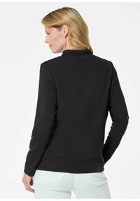 Zwarte lange mouw top met een gestructureerd, ribbelontwerp en een hoge halslijn, met strakke mouwen en een ontspannen silhouet.