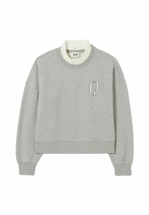 Sweat-shirt gris court avec un col et des poignets en côte blancs. Présente un logo "CP" brodé sur la poitrine. Fabriqué en coton doux.