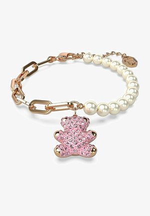 Pingente de urso cor-de-rosa com strass numa pulseira com elos de metal dourado em alternância e pérolas brancas, fecho ajustável.