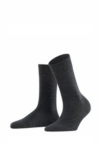 Calze in misto cotone grigie scure con una texture liscia, lunghezza a mezzocalf, e design semplice, dotate di punta e tallone rinforzati.