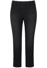 Pantalones de mezclilla negros con cintura elástica, diseño de pierna recta y detalles de costura sutiles. Textura suave y corte de altura media.