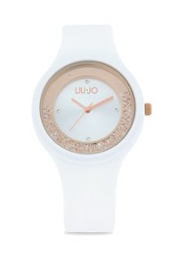 Hvid silikoneur med en rosaguld bezel, krystalbesat urskive og lyseblå ansigt, der viser sølvfarvede visere og et logo.