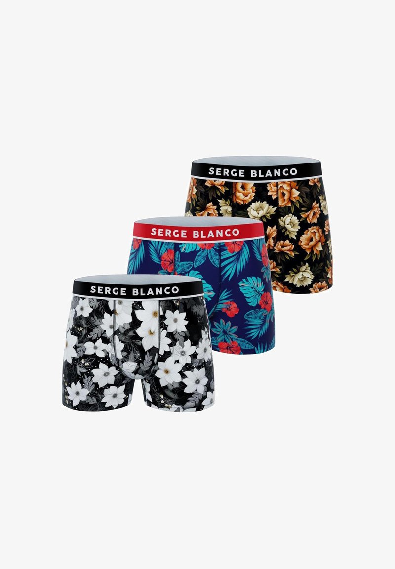 Trois paires de caleçons à motifs floraux. Les couleurs comprennent le noir, le bleu marine et le rouge. Tailles élastiques avec la marque "SERGE BLANCO".