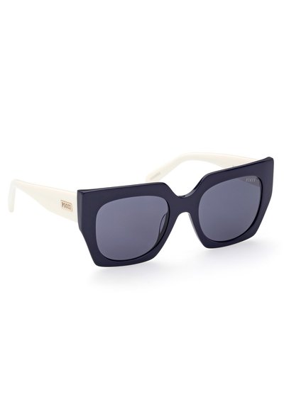 Oversized sunglasses featuring a black frame with white temples, dark lenses, and a gold logo detail on the side.