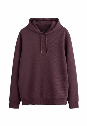 Bordo kapuce ar reljefa, šūnveida rakstu. Iespēja ar aukliņu uz galvas un ribotām piedurknēm un apakšmalu. Gluda auduma apdare.