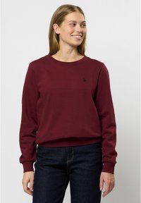 Felpa bordeaux realizzata in morbido cotone, con scollatura rotonda, polsini a coste e un piccolo logo sul petto.