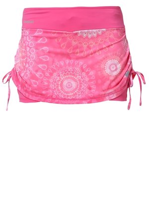 Jupe de sport rose avec motifs floraux circulaires blancs et liens latéraux réglables pour un effet froncé.