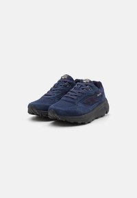 Navy blue sneakers with suede upper, mesh panels, padded collar, and black rubber sole. Features laces and brand logo on the tongue.