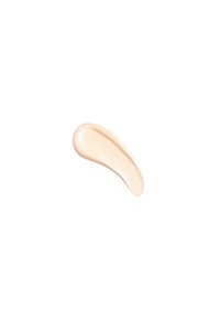 Campione di crema beige con una texture liscia e lucida, a forma di goccia, su uno sfondo bianco uniforme.