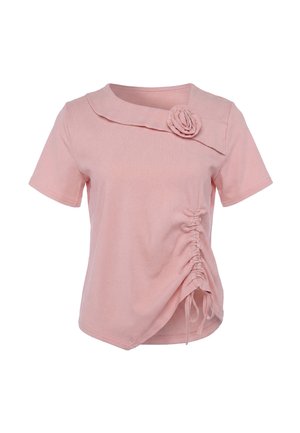 Light pink short-sleeve blouse with an asymmetrical collar, fabric rose detail on the chest, and ruched drawstring side on the lower front.