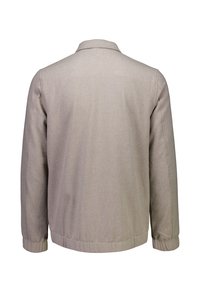 Beżowa długa kurtka z długim rękawem, kołnierzem i elastycznymi mankietami, pokazana z tyłu na białym tle.