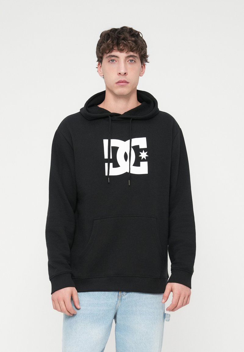 Black hoodie made of cotton blend, featuring a large white logo at the center, ribbed cuffs, a kangaroo pocket, and a drawstring hood.