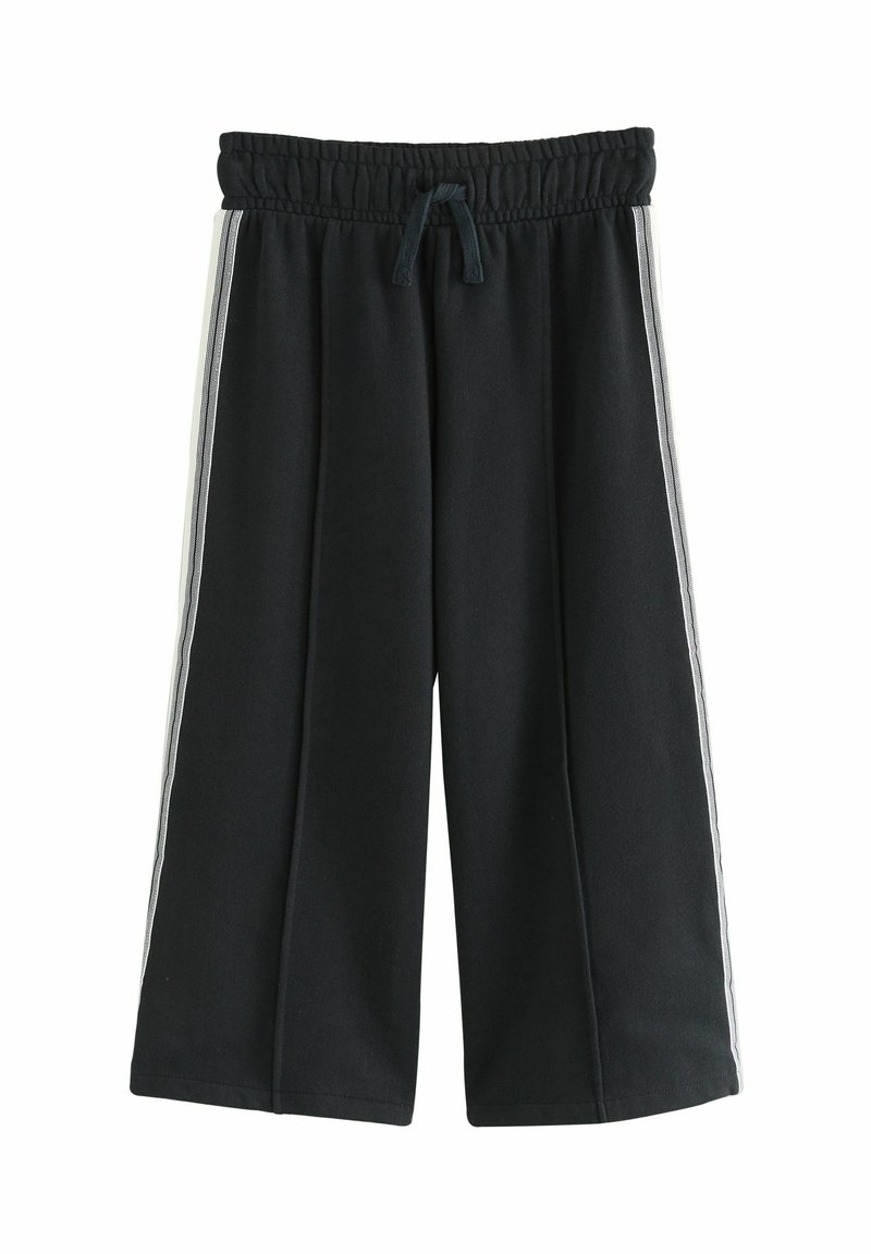 Schwarze cropped Sweatpants mit elastischem Bund, Kordelzug und kontrastierenden weißen Seitenstreifen. Weiche Textur, weit geschnittenesDesign.