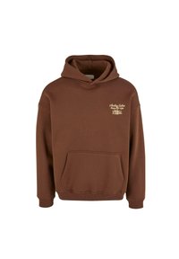 Brun hettegenser med frontlomme og hette. Har en liten hvit logo på brystet. Lages i myk stoff med ribbestrikkede mansjetter på ermene.