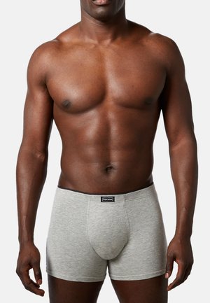 Boxer briefs grigi in cotone con un design aderente, vita nera con logo, struttura liscia e senza motivi visibili.