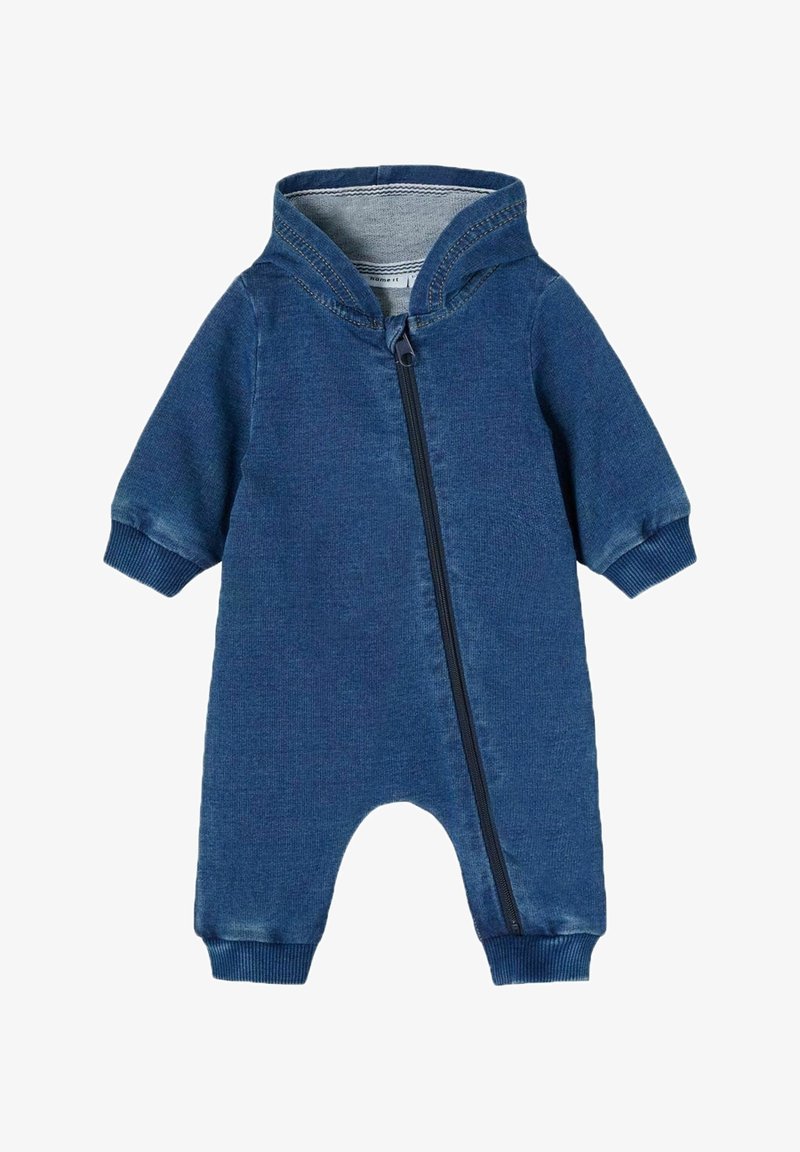 Combinaison à capuche bleue en tissu doux, avec une fermeture éclair à l'avant et des poignets côtelés pour un ajustement confortable. Idéale pour le confort et pour un enfilage facile.