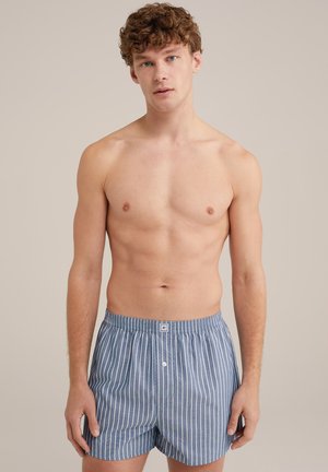 Blue and white striped cotton boxer shorts with a relaxed fit, featuring an elastic waistband and a front button closure.