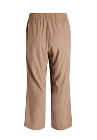 Beige cropped bukser lavet af blødt stof med elastisk talje. Texturen fremstår glat med subtile lodrette ribbede detaljer.