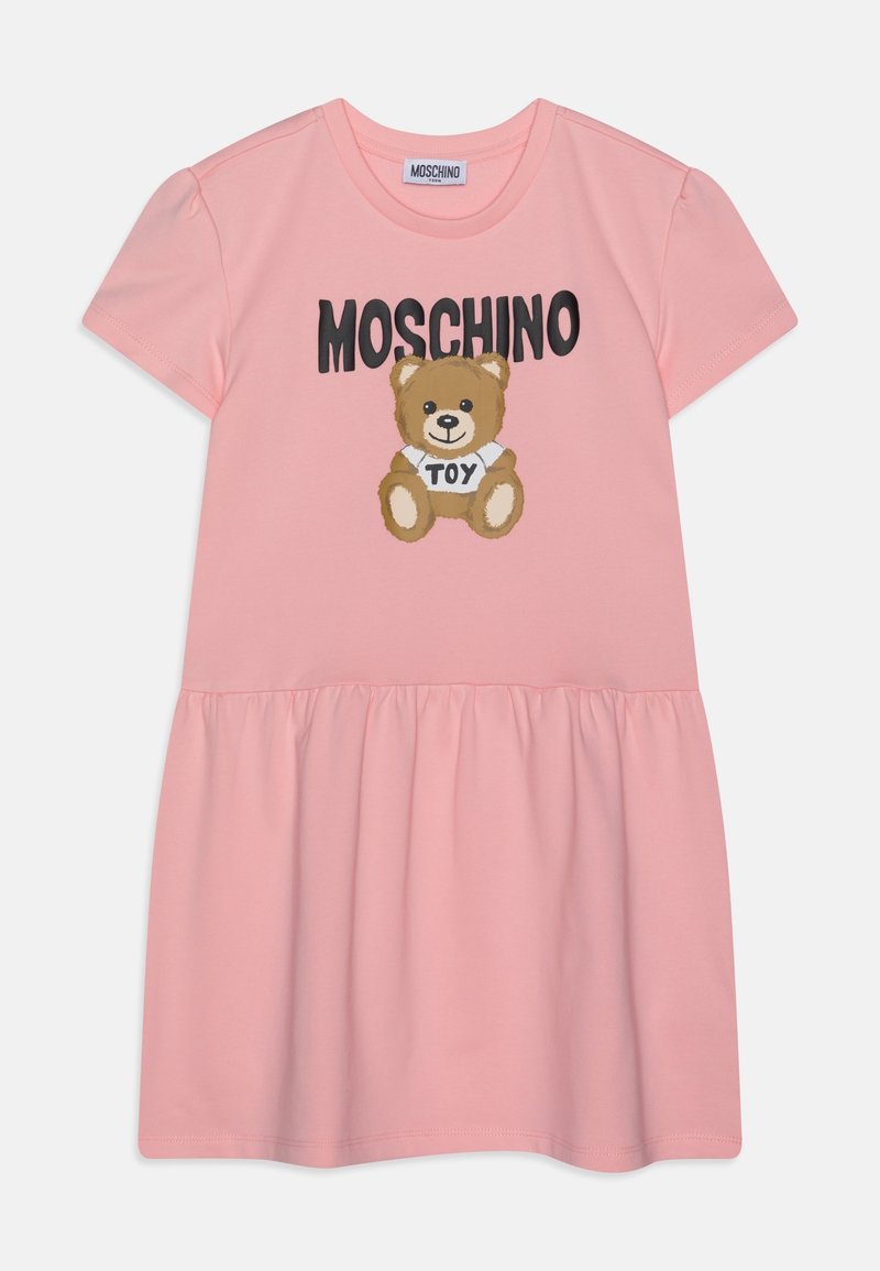 Rosa Baumwollkleid mit kurzen Ärmeln, versehen mit einem Bärenmotiv und dem schwarzen Schriftzug "MOSCHINO". Ausgestellter Rock mit gerafftem Taillenbereich.