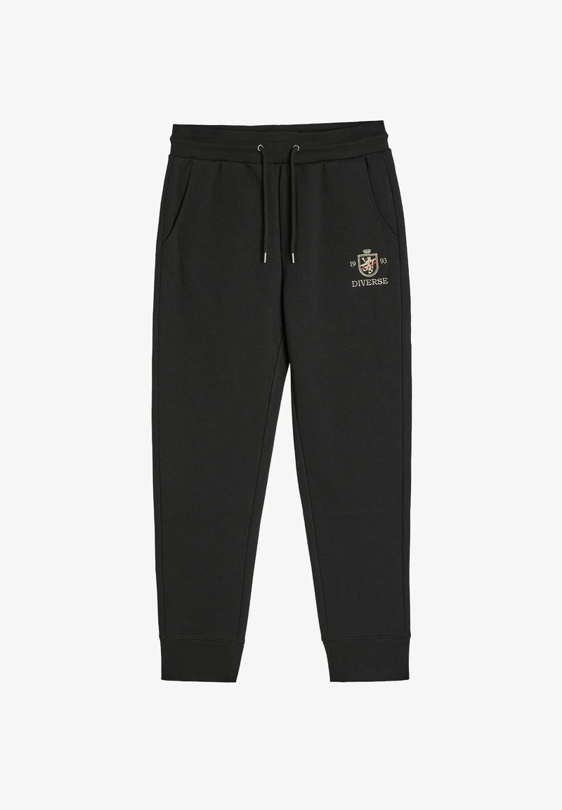 Czarne bawełniane dresy z elastycznym pasem, sznurkiem, bocznymi kieszeniami oraz haftowanym złotym logo na lewym udzie.