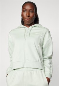 adidas Sportswear ENERGIZE - Tracksuit - linen green