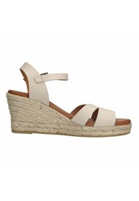 Helle beige Wedge-Sandalen mit strukturierten Lederriemen und einer gewebten Jute-Plattform. Verstellbarer Knöchelriemen mit einem dezenten Schnallendetail.