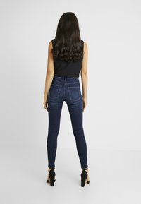 ONLY Tall ONLGOSH HIGHWAIST - Calças de ganga de corte skinny - dark blue denim