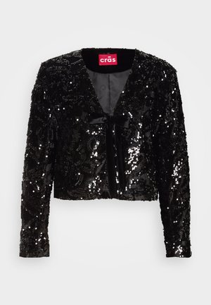 Svart paljettkort jakke med lange ermer, med V-hals, myk tekstur og frontsløjfe detalj. Fôret indvendigt uten ytterligere mønstre.