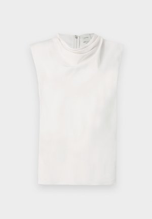 Biely tielkový top s imitáciou roláka a zapínaním na zips na chrbte, zobrazený na rovnom povrchu na bielom pozadí.