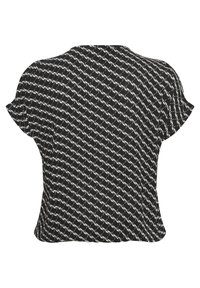 Top corto a maniche corte con motivo in bianco e nero e vestibilità comoda. Presenta un collo rotondo e un tessuto leggermente strutturato in tutto il capo.