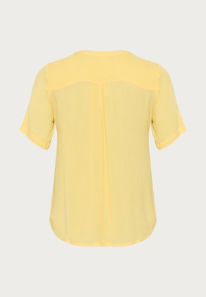 Geltonas trumpomis rankovėmis marškinėliai su laisvu siluetu, apvaliu iškirpimu, užpakaliniais raukiniais ir minkšta, tekstūrine medžiaga.