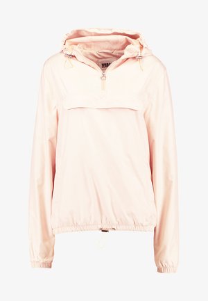 Light pink pullover jacket in water-resistant material. Features a hood, half-zip front, elasticated cuffs, and adjustable hem drawstring.