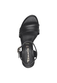 Sandalo in pelle nera con tre cinturini decorativi, una cinghia alla caviglia regolabile e una superficie liscia. Presenta una soletta con il marchio.