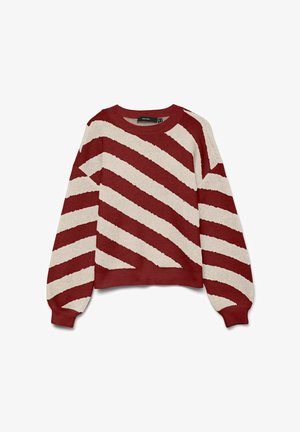 Rdeče in kremasto prugasta jopica iz mehkega, strukturiranega materiala. Ima krogu izrez in dolge, rahlo napihnjene rokave. Poudarjena je z diagonalnimi črtami.