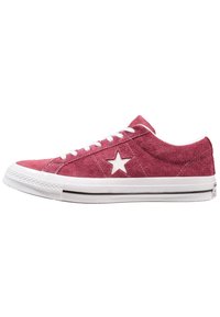 Burgundy suede sneaker with white laces, star accent on side, white rubber sole, and black stripe. Low-top design, textured upper.