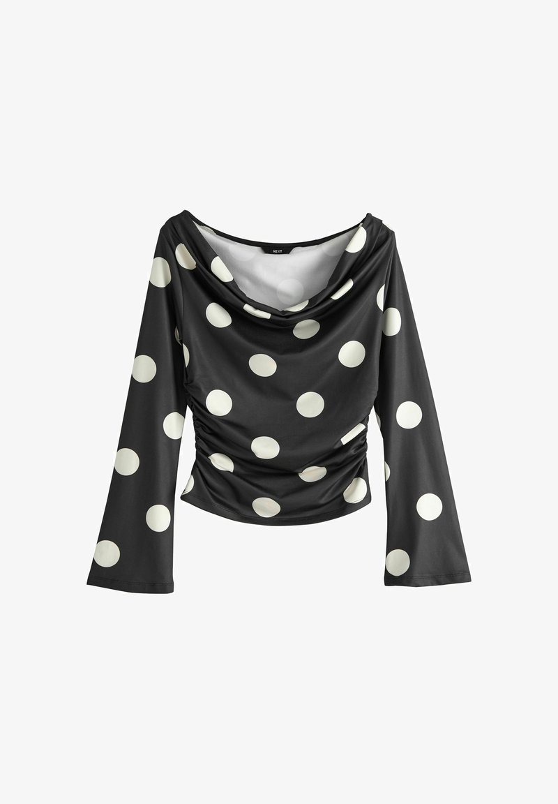 Bluză neagră cu mâneci lungi, cu buline mari albe, decolteu drapat și laterale strânse, oferind o siluetă mulată.