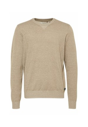 Bežinis megztinis su ilgomis rankovėmis, V formos iškirpte, raukšlėtais rankogaliais ir apgadintais kraštais, ir maža logotipo etiketė apatiniame šone. Minkšta tekstūra.