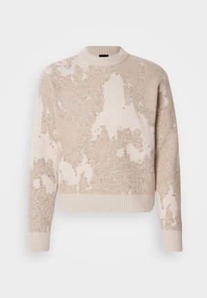 Beige and cream textured knit sweater with abstract patterns, ribbed crew neck, cuffs, and hem, displayed on a white background.