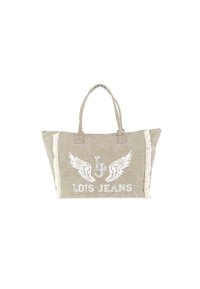 Bolsa tote beige con asas dobles, que presenta un logo impreso con alas, acentos de flecos en un lado y un acabado de tela texturizada.
