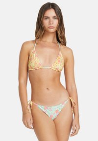 Floral bikini set featuring a triangle top with yellow and pink flowers, and matching tie-side bottoms in a mint green color.