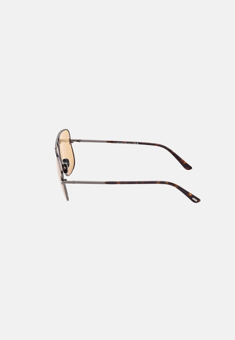 Metal sunglasses with a silver frame, light brown lenses, and tortoiseshell-patterned temple tips. Slim design with a curved shape.