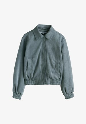 Roheline kunstnahast jakk kraega kaeluse, elastse vöökohaga ja kahe küljetaskuga. Omaduseks on sile tekstuur ja lõdvestunud istuvus.