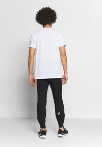 ASICS BIG LOGO SWEAT PANT - Calças de fato de treino - performance black/brilliant white