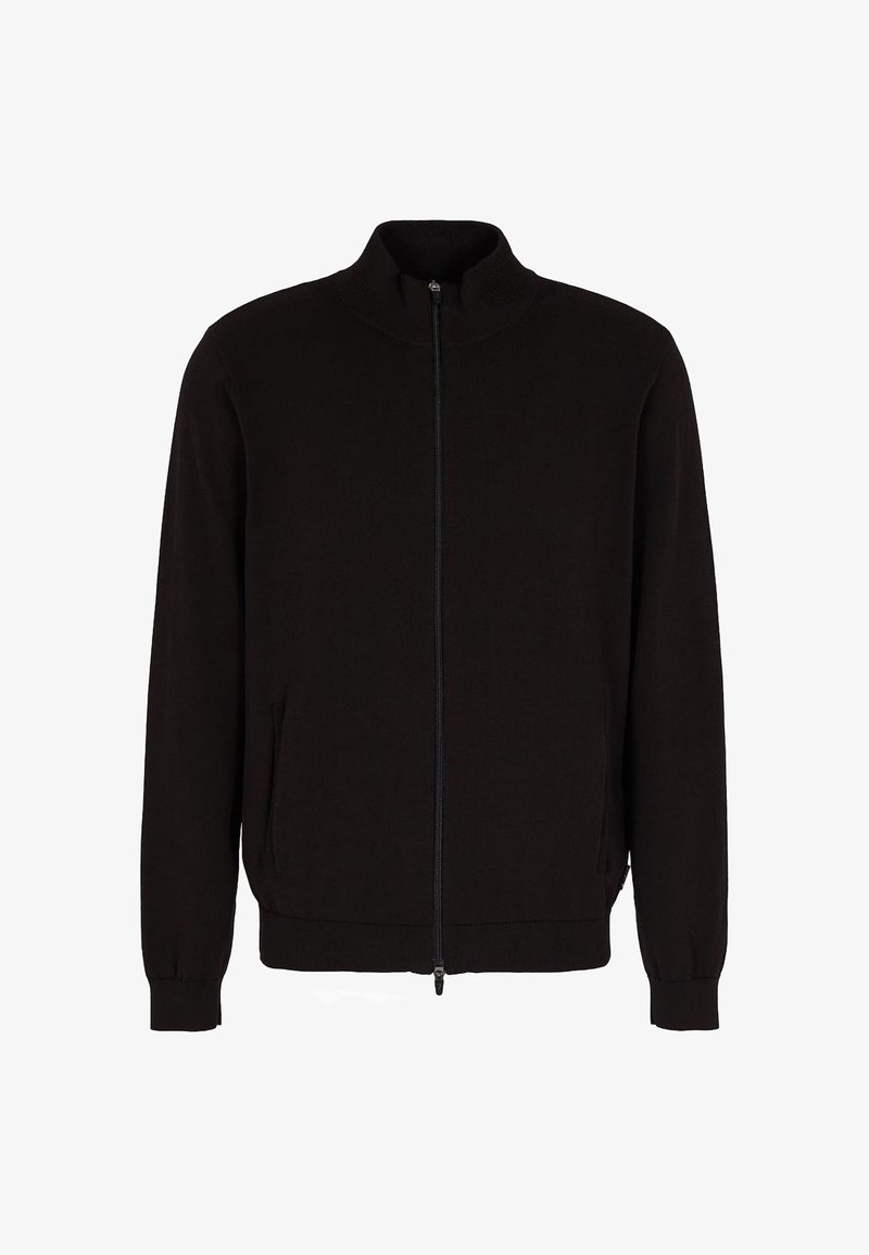 Veste noire zippée intégrale avec col montant, manches longues, poignets côtelés et poches latérales, présentée sur fond blanc.