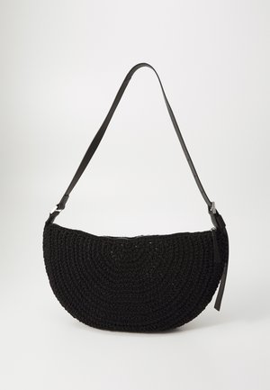Black woven bag with a semi-circular shape, featuring a textured crochet finish and a slender adjustable leather strap.