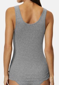 Gray, ribbed tank top featuring a rounded neckline and wide armholes, showcasing a fitted design and soft, stretchy fabric.