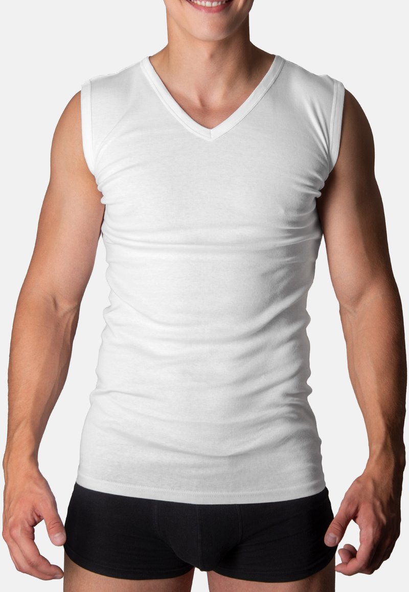 White sleeveless v-neck shirt made of cotton, form-fitting design; smooth texture with a clean finish at the neckline and hem.