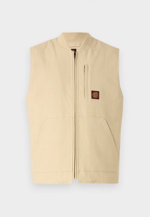 Gilet sans manches beige avec une fermeture éclair à l'avant, un col côtelé, deux poches latérales et un petit logo noir et rouge sur la poitrine. Tissu texturé.