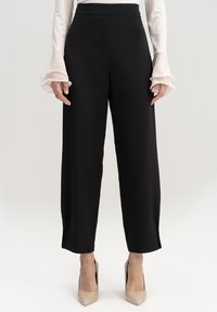 CUFF - Püksid - black