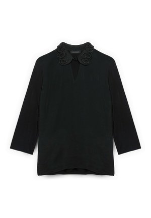 Schwarzes Oberteil aus strukturiertem Stoff mit einem dekorativen, mit Perlen besetzten Kragen und einem Schlüsselloch-Ausschnitt. Lange Ärmel mit leicht abgerundetem Saum.
